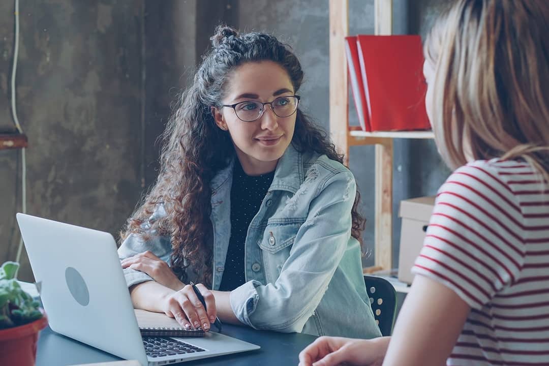 Two female entrepreneurs engaged in a discussion